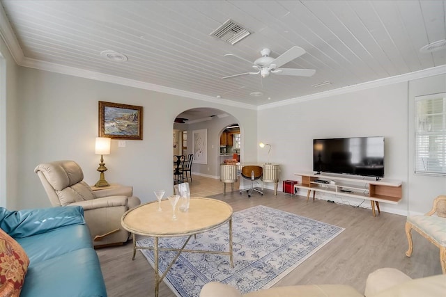 living room featuring crown molding, ceiling fan, and light hardwood / wood-style floors