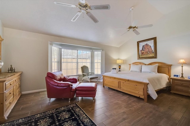 bedroom with ceiling fan, dark hardwood / wood-style floors, and vaulted ceiling