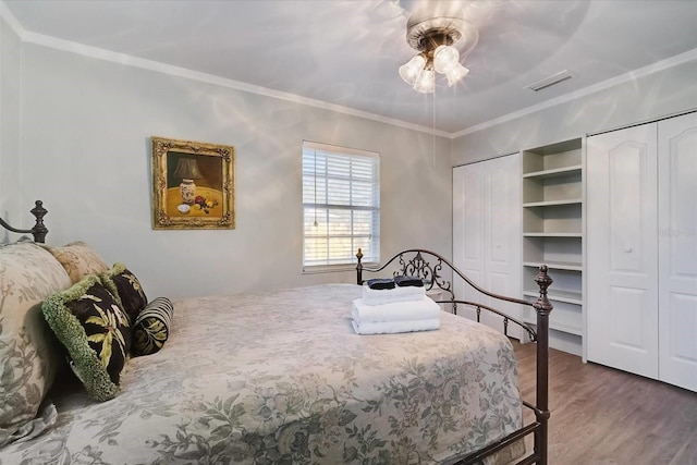 bedroom featuring crown molding, ceiling fan, and wood-type flooring