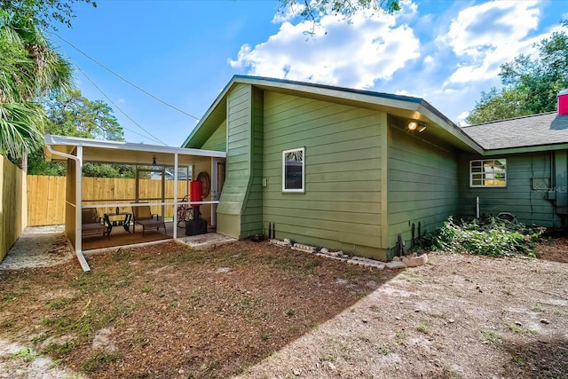 view of side of home featuring a patio area