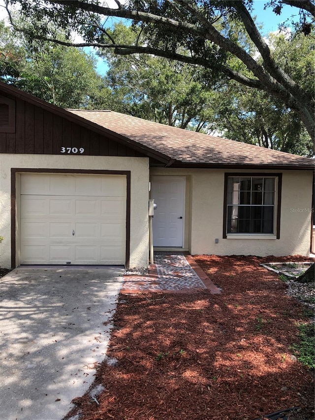 ranch-style house featuring a garage