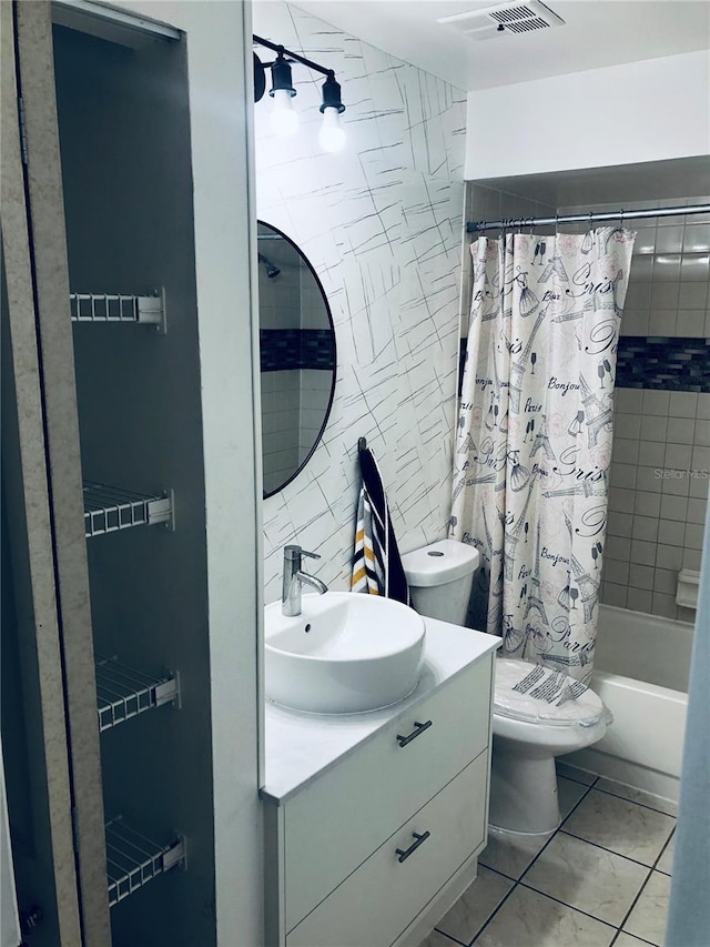 full bathroom with toilet, tile patterned floors, vanity, shower / bathtub combination with curtain, and tile walls