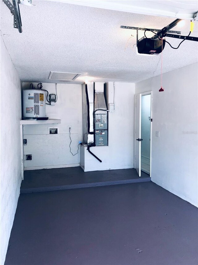 garage with a garage door opener, heating unit, and electric water heater