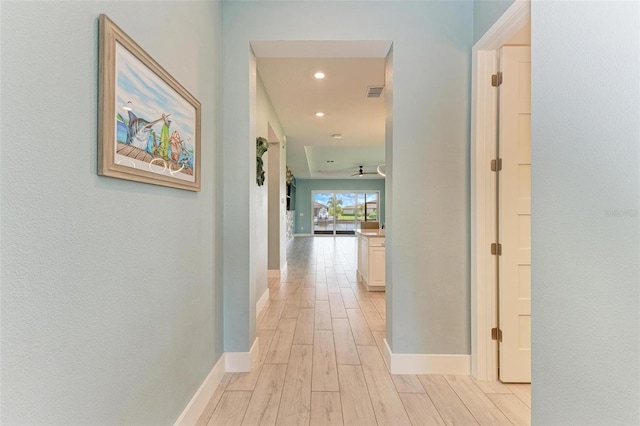 corridor featuring light hardwood / wood-style flooring