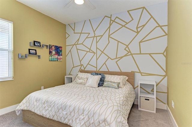 carpeted bedroom with ceiling fan and multiple windows