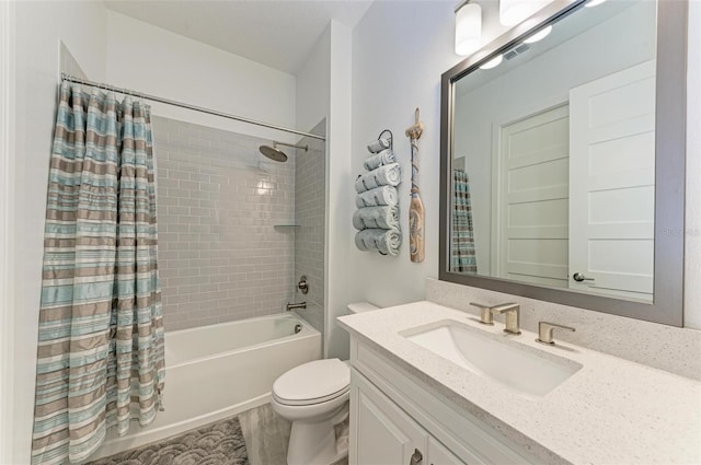 full bathroom with shower / bathtub combination with curtain, toilet, and vanity