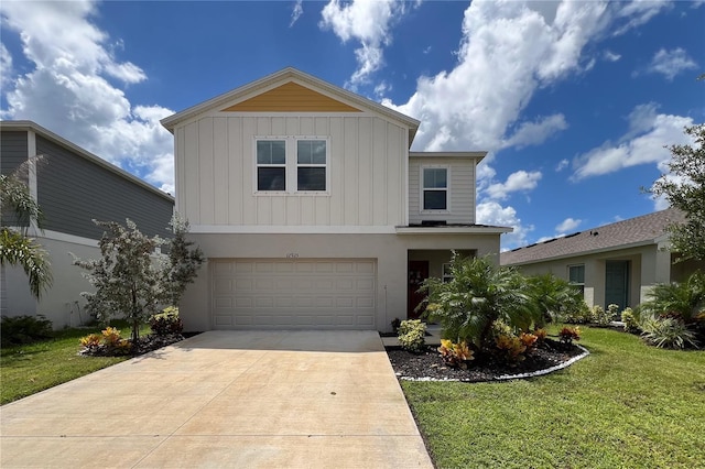 view of front facade with a garage and a front lawn