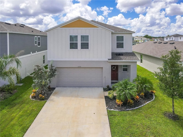 view of front of home with a garage and a front yard