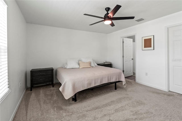 carpeted bedroom featuring ceiling fan