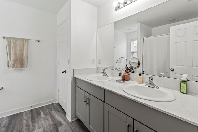 bathroom featuring hardwood / wood-style flooring and vanity