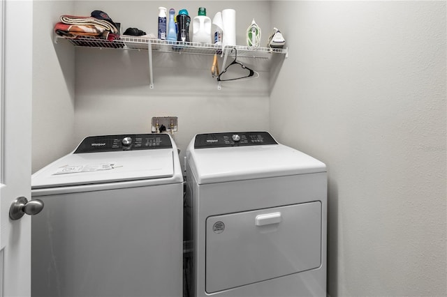 washroom featuring washer and clothes dryer