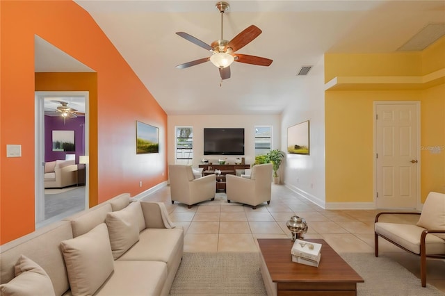 13460 Marquette Blvd, Fort Myers, FL 33905 - living room with light tile patterned floors, vaulted ceiling, and a ceiling fan
