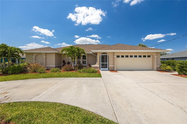 13460 Marquette Blvd, Fort Myers, FL 33905 - ranch-style home featuring driveway, an attached garage, and stucco siding