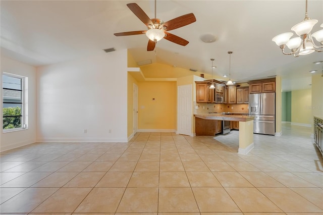 13460 Marquette Blvd, Fort Myers, FL 33905 - kitchen with stainless steel appliances, brown cabinets, and light tile patterned floors