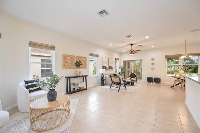 interior space with ceiling fan