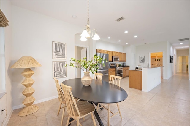 dining room with light tile patterned floors, an inviting chandelier, visible vents, and recessed lighting