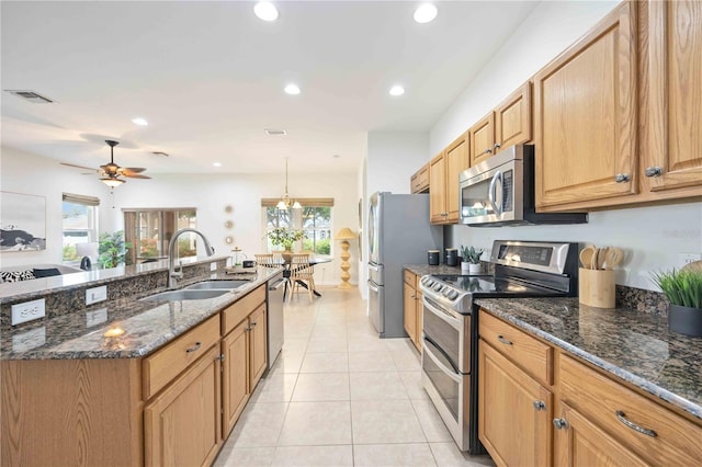 kitchen with visible vents, light tile patterned flooring, stainless steel appliances, a sink, and recessed lighting