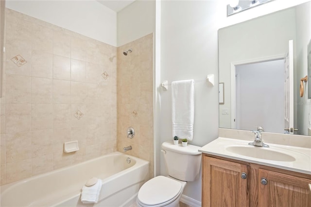 bathroom featuring bathtub / shower combination, vanity, and toilet