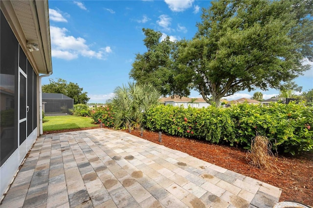 view of patio with a lanai