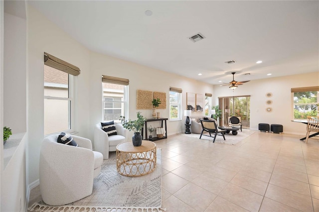 living area featuring light tile patterned floors, plenty of natural light, and visible vents