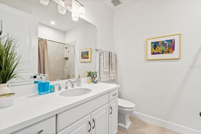 bathroom with toilet, vanity, a shower with curtain, and tile patterned floors