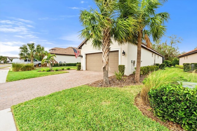 mediterranean / spanish house featuring a front lawn