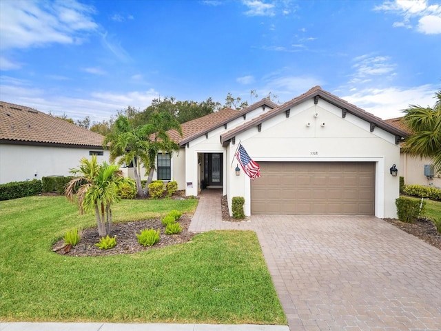 view of front facade featuring a front lawn and a garage