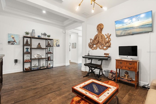 living room with dark hardwood / wood-style floors and an inviting chandelier