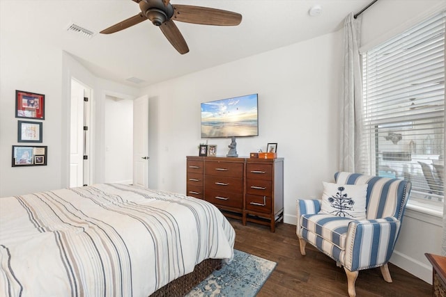 bedroom featuring ceiling fan and dark hardwood / wood-style floors