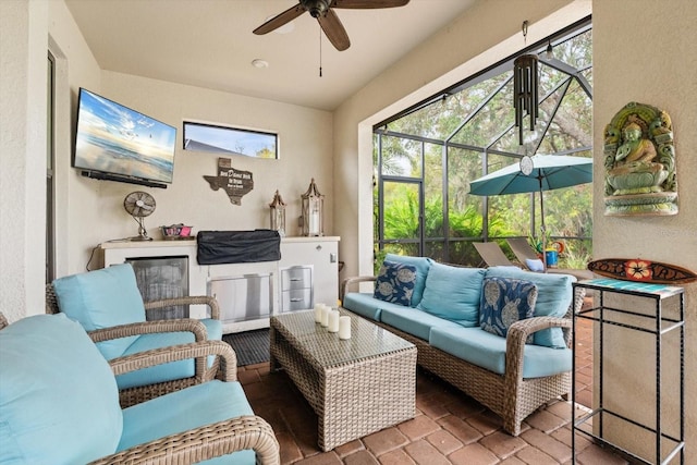 sunroom featuring ceiling fan