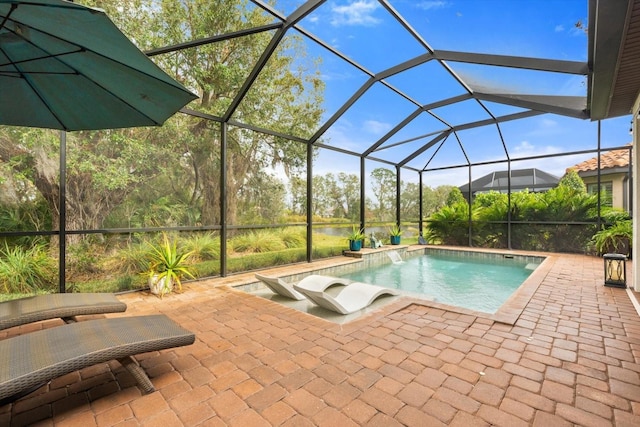 view of pool featuring a lanai and a patio