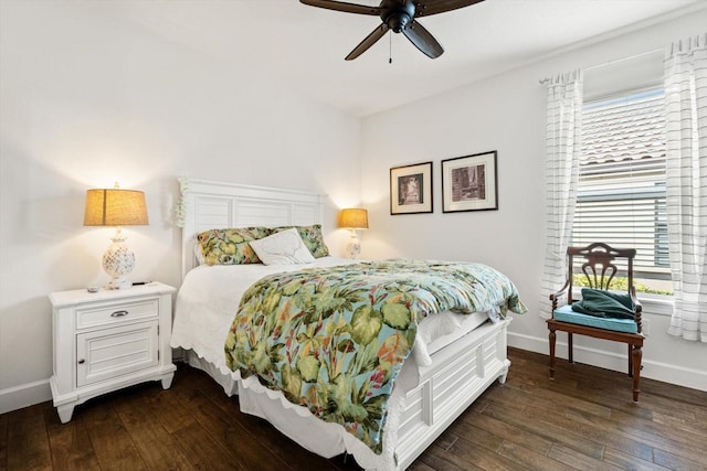 bedroom featuring ceiling fan and dark wood-type flooring