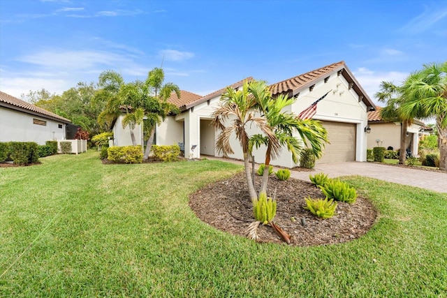 mediterranean / spanish home with a garage and a front yard