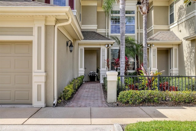 doorway to property with a garage