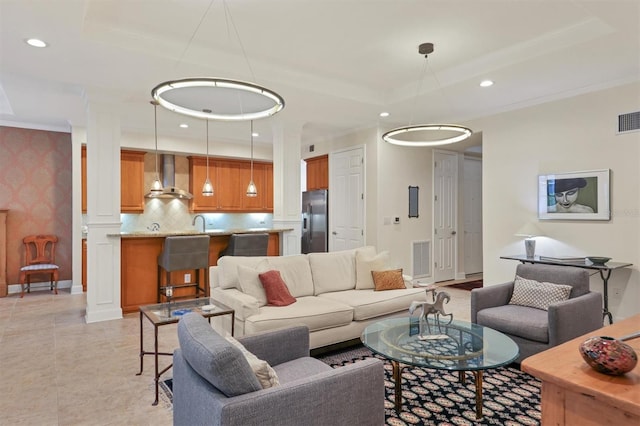 tiled living room featuring decorative columns