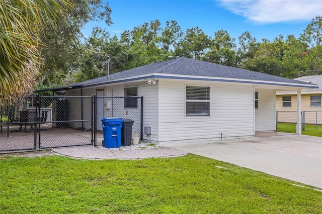 view of side of home with a yard and a patio