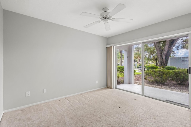 carpeted empty room with ceiling fan