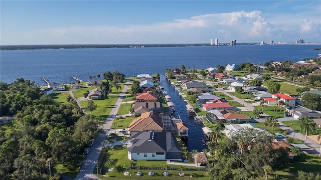 birds eye view of property featuring a water view