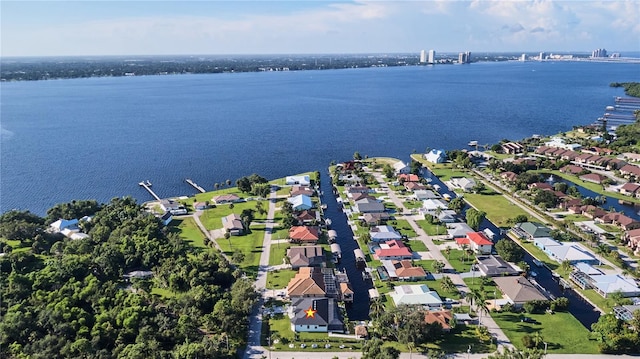 birds eye view of property featuring a water view