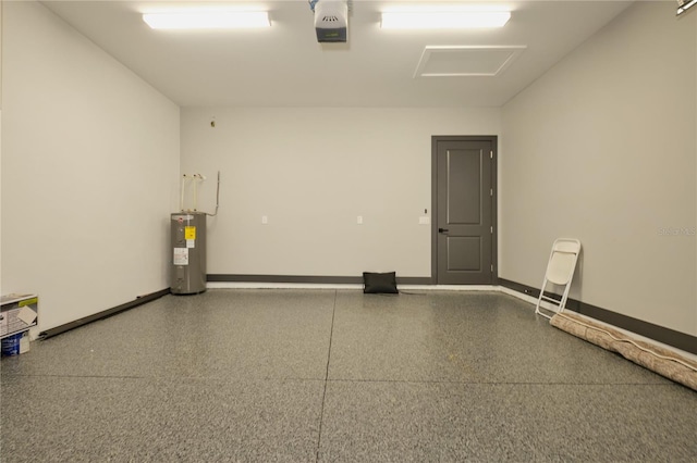 garage featuring a garage door opener and water heater