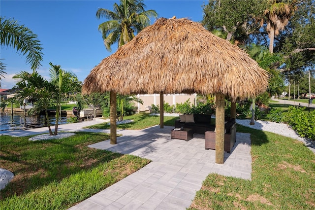 surrounding community featuring a gazebo, a yard, and a water view