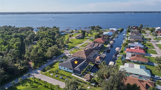 birds eye view of property with a water view