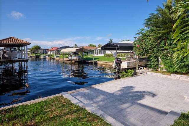 view of dock with a water view and a lanai