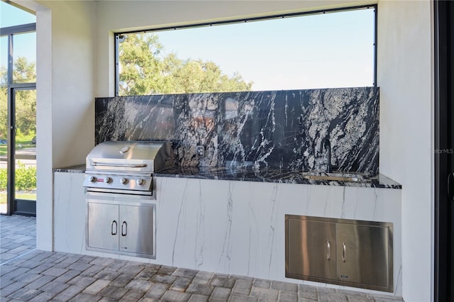 view of patio / terrace with an outdoor kitchen and area for grilling