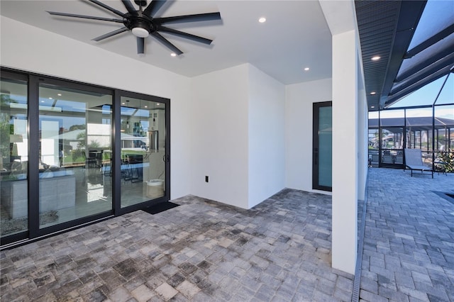 spare room with ceiling fan and plenty of natural light