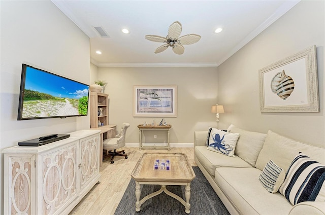 living room with light wood finished floors, baseboards, visible vents, and ornamental molding