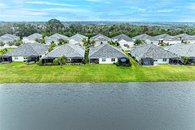 birds eye view of property featuring a residential view and a water view