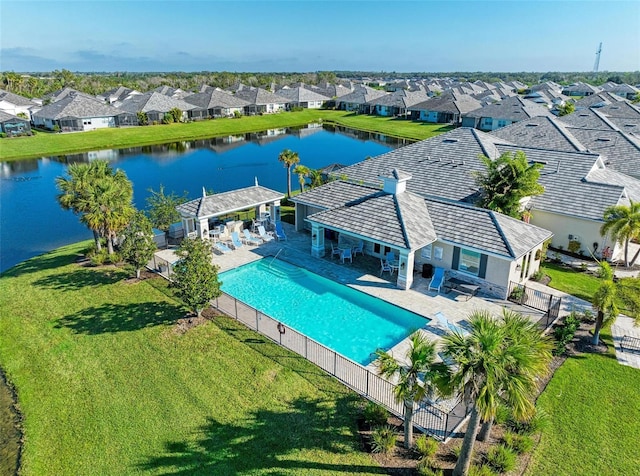 aerial view featuring a residential view and a water view