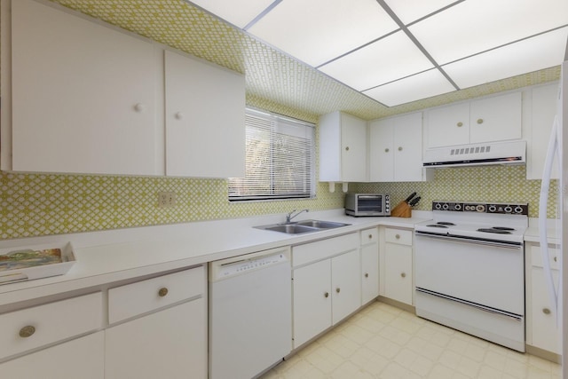 kitchen featuring sink, white appliances, white cabinets, and extractor fan