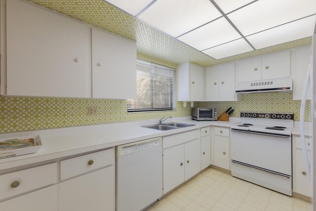 3500 El Conquistador Pkwy Unit 238, Bradenton, FL 34210 - kitchen featuring white appliances, exhaust hood, light countertops, and decorative backsplash